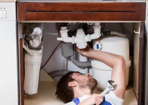 plumber fixing pipe